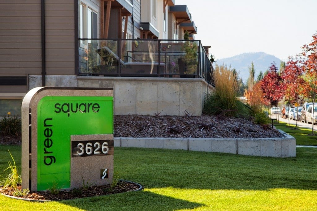 green square sign 3626 besides condo units